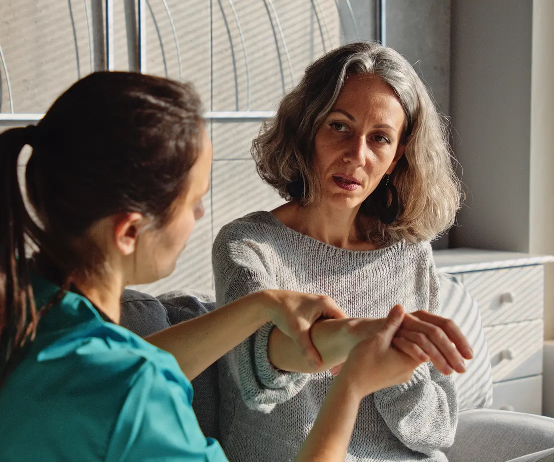 Woman receiving medical in comfort of her home