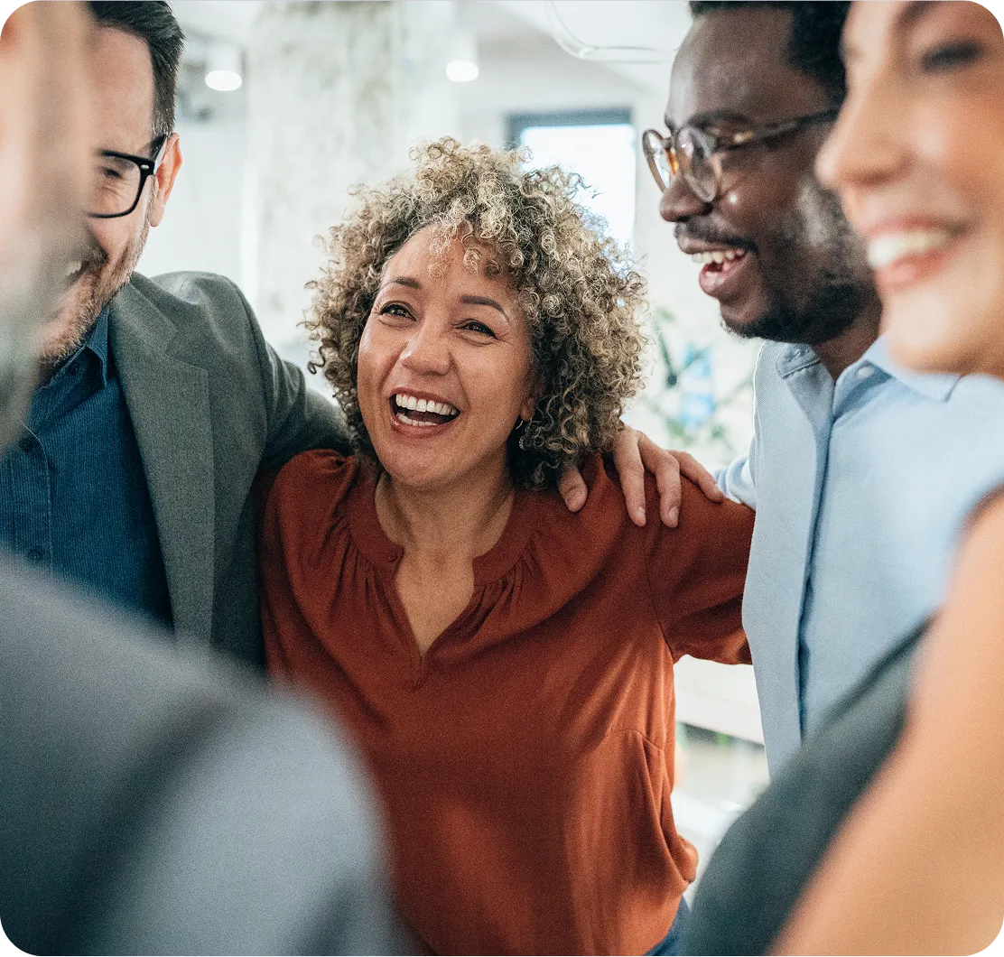 A group of colleagues laughing together