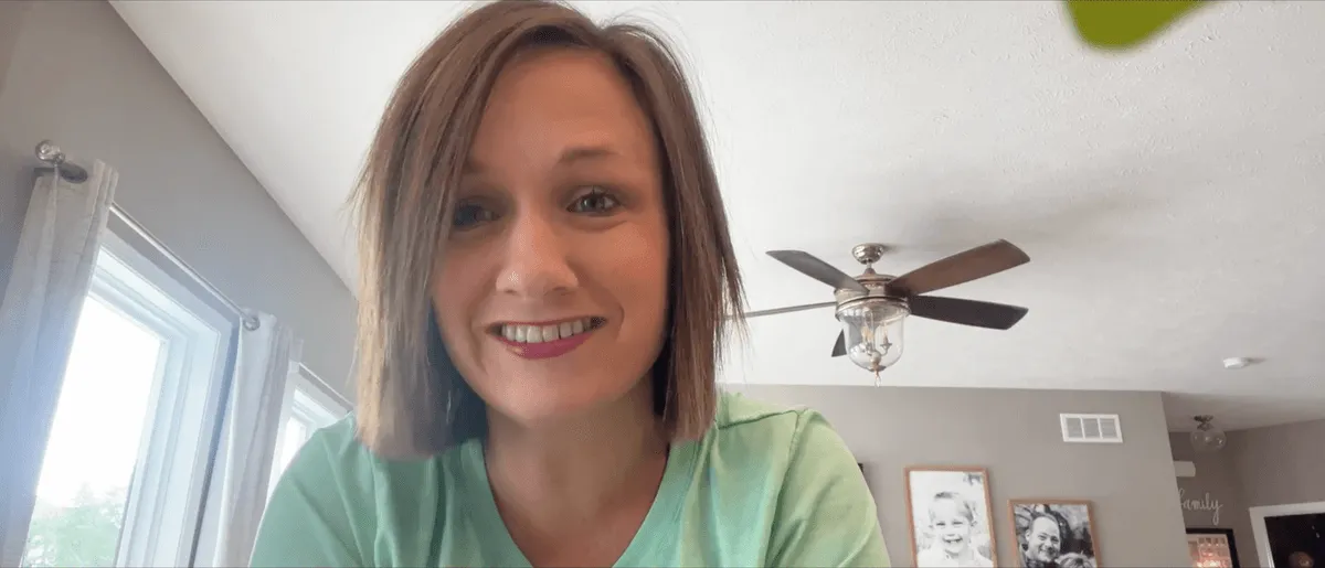 Sasha smiling during a video call testimonial